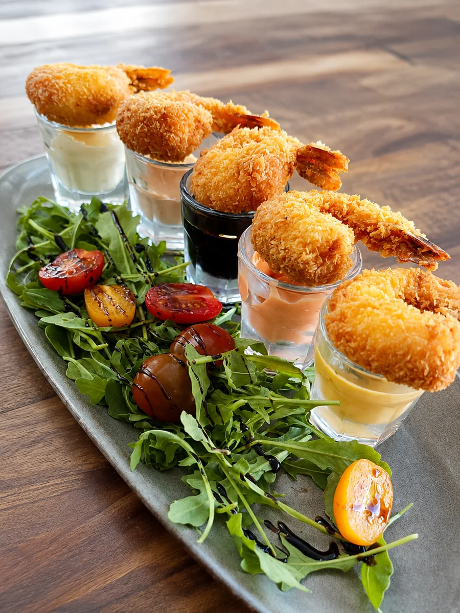 Golden crumbed seafood with salad and dipping sauces