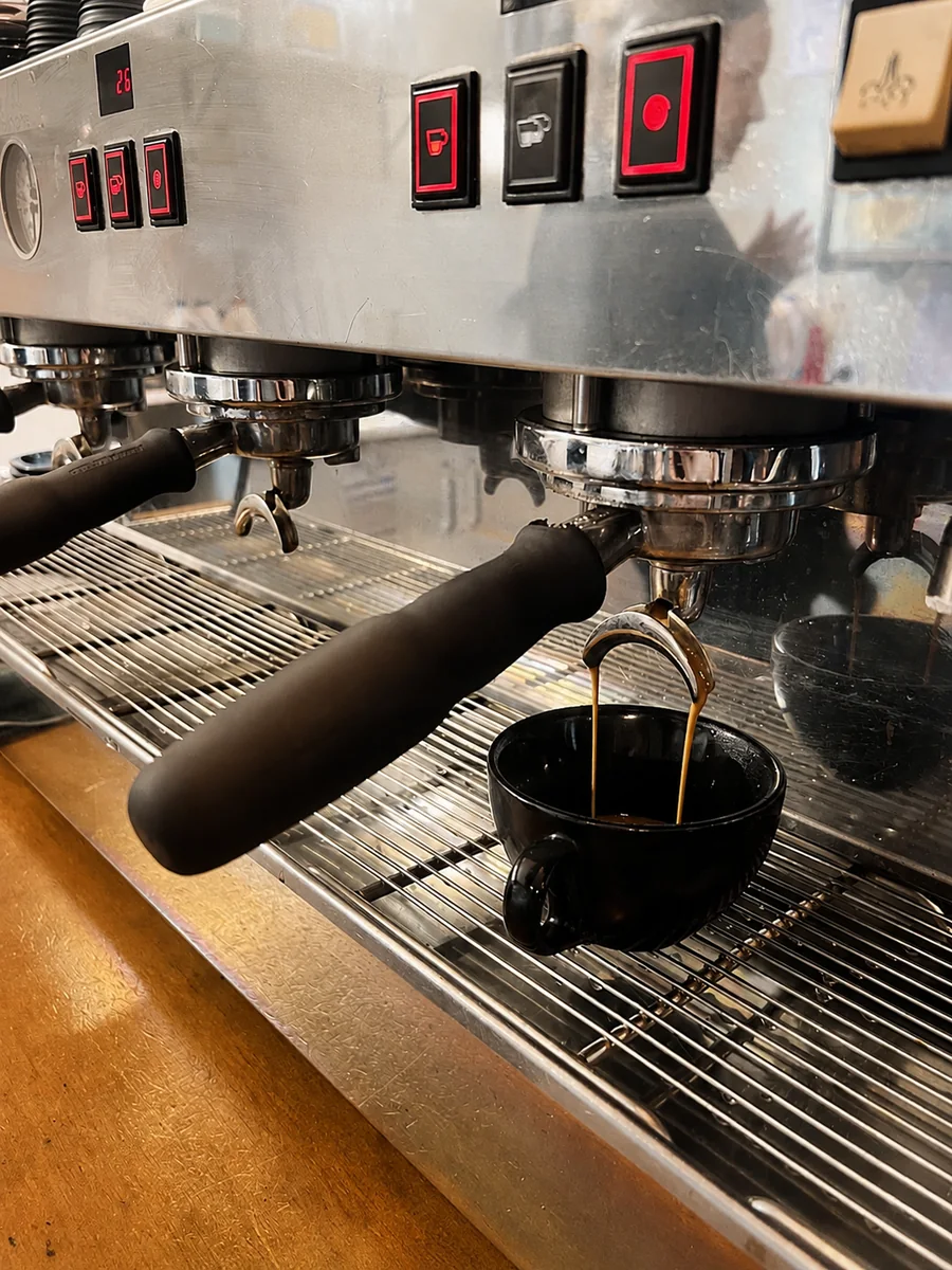 Coffee being prepared at the espresso machine